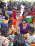 Children doing an arts and crafts with Mihiri and Charlini 