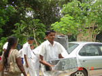 STudent helping to unload computers